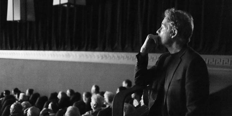 Cinema guest Kevin Kline watches a film.